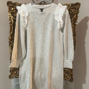 Gorgeous sweater dress with eyelets trim on the front